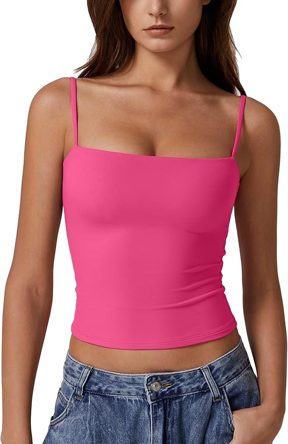 Hot pink spaghetti strap cami top with a fitted, stretchy silhouette, perfect for summer layering.