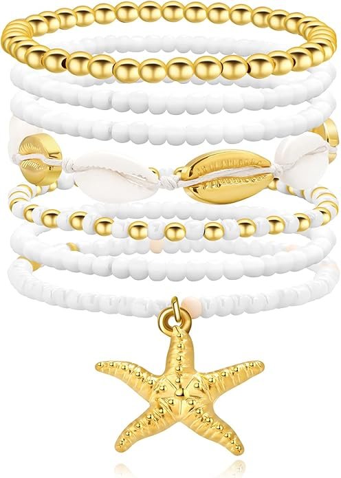 Set of layered gold, white, and shell-inspired bracelets with a dangling starfish charm.