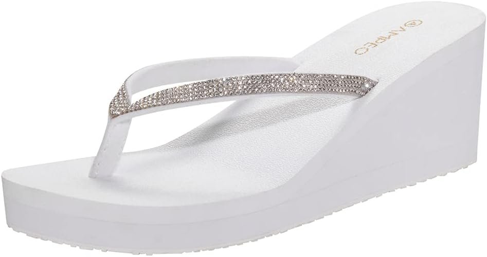 White platform flip-flops with rhinestone straps and wedge sole for height and beachy comfort.